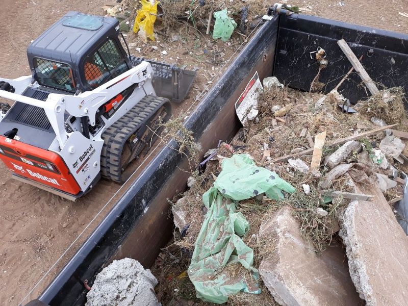 rubbish-in-bin-bobcat-on-side rubbish-in-bin-bobcat-on-side